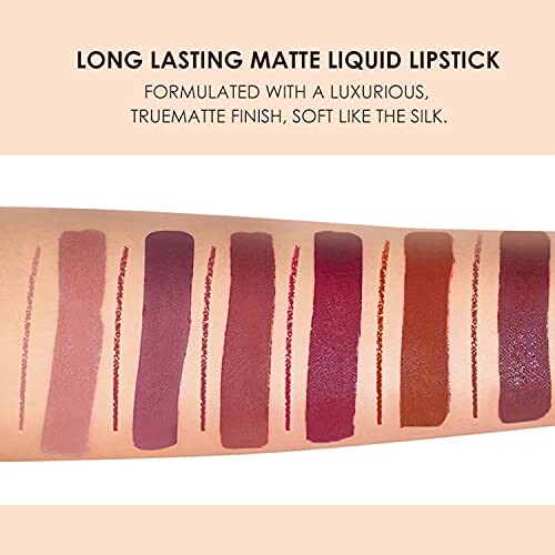 Swatches of long-lasting matte liquid lipstick in various shades on an arm.